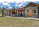 Relaxing front porch with comfortable seating and stylish wood pillars at 25350 Ridge Way, Golden, CO 80401