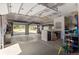 Spacious three-car garage with high ceilings, potential for storage, and multiple access doors at 25350 Ridge Way, Golden, CO 80401