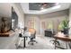 Bright home office featuring multiple desks, natural light, and outdoor views at 25350 Ridge Way, Golden, CO 80401