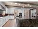 This spacious kitchen features an island with granite counters, pendant lighting, and wood floors at 25350 Ridge Way, Golden, CO 80401
