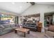Comfortable living room with a vaulted ceiling that opens to the kitchen and out to the back porch at 25350 Ridge Way, Golden, CO 80401
