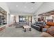 Bright living room with vaulted ceilings, plush carpeting, and an open layout at 25350 Ridge Way, Golden, CO 80401