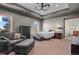 Main bedroom with a seating area, gray walls, and large windows at 25350 Ridge Way, Golden, CO 80401