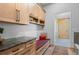 Well-organized mudroom with built-in bench, storage cabinets, and view to the outside at 25350 Ridge Way, Golden, CO 80401