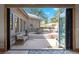 Outdoor patio featuring a dining table, comfortable seating, and concrete flooring at 25350 Ridge Way, Golden, CO 80401