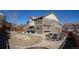 Panoramic view of a backyard with a patio, fire pit area, and mature landscaping, perfect for entertaining at 1665 Avery Way, Castle Rock, CO 80109