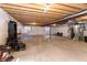 Unfinished basement with exposed beams, concrete flooring, and visible utilities. Ready to be finished your way at 1665 Avery Way, Castle Rock, CO 80109