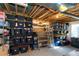 Unfinished basement with black shelving units and plastic storage tubs perfect for organizing belongings at 1665 Avery Way, Castle Rock, CO 80109