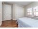 Bright bedroom with wood floors, a large closet, and a window with a neighborhood view at 1665 Avery Way, Castle Rock, CO 80109