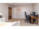 Neutral bedroom featuring a desk area, carpet flooring, and a closet with sliding doors at 1665 Avery Way, Castle Rock, CO 80109