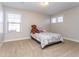 Bright bedroom with cozy carpet, a window with blinds, and a small bed at 1665 Avery Way, Castle Rock, CO 80109
