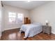Simple bedroom with wood floors, neutral walls, and built-in storage at 1665 Avery Way, Castle Rock, CO 80109