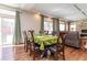Bright dining area with wood floors, a tray ceiling, and sliding doors to the backyard at 1665 Avery Way, Castle Rock, CO 80109