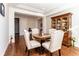 Elegant dining room featuring hardwood floors, stylish furniture, and ample natural light; ideal for gatherings at 1665 Avery Way, Castle Rock, CO 80109