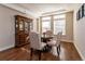 Elegant dining room with hardwood floors, stylish furniture, and ample natural light; perfect for entertaining at 1665 Avery Way, Castle Rock, CO 80109