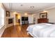 Spacious main bedroom suite with hardwood floors, fireplace, and en-suite bathroom at 1665 Avery Way, Castle Rock, CO 80109