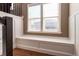 Bright window seat with custom millwork, natural light, and hardwood flooring at 1665 Avery Way, Castle Rock, CO 80109