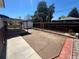Spacious backyard featuring a covered patio, providing an ideal space for outdoor gatherings at 7021 Saulsbury St, Arvada, CO 80003