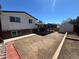 Wide backyard featuring a covered patio and a storage shed, creating an outdoor haven at 7021 Saulsbury St, Arvada, CO 80003