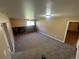 Finished basement with a cozy brick fireplace, perfect for entertaining or relaxing at 7021 Saulsbury St, Arvada, CO 80003