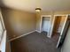 Bright bedroom features a closet and neutral decor, creating a cozy and inviting space at 7021 Saulsbury St, Arvada, CO 80003