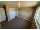 Bedroom featuring neutral walls, carpeted floors, closet, and a window providing natural light at 7021 Saulsbury St, Arvada, CO 80003