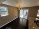 Inviting dining area with hardwood floors and sliding glass doors leading to the backyard patio at 7021 Saulsbury St, Arvada, CO 80003