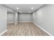 Spacious finished basement with gray walls and wood-look floors at 3520 W 95Th Ave, Westminster, CO 80031