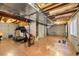 Unfinished basement with potential for customization, featuring painted floors and exposed ductwork at 23662 E Alabama Dr, Aurora, CO 80018