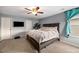 Relaxing bedroom features a ceiling fan, neutral walls, and plush carpet at 23662 E Alabama Dr, Aurora, CO 80018