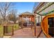 Wooden gazebo on a deck with outdoor seating, perfect for entertaining guests. Nearby cedar sauna at 23662 E Alabama Dr, Aurora, CO 80018