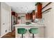 Kitchen featuring a breakfast bar, pendant lights, marble countertops, and stainless steel appliances at 23662 E Alabama Dr, Aurora, CO 80018
