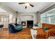 Cozy living room showcasing a modern fireplace, neutral colors, and ample natural light at 23662 E Alabama Dr, Aurora, CO 80018