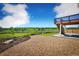 Backyard with stone landscaping, a concrete patio, and unobstructed views of a green space at 2515 Clayton Cir, Superior, CO 80027