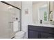 Bathroom featuring a walk-in shower, toilet, and vanity with quartz countertops and black fixtures at 2515 Clayton Cir, Superior, CO 80027