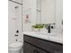 Bathroom featuring a walk-in shower, and vanity with quartz countertops and black fixtures at 2515 Clayton Cir, Superior, CO 80027