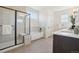 Bright bathroom featuring a walk-in shower, soaking tub, and modern vanity with neutral color tones at 2515 Clayton Cir, Superior, CO 80027