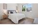 Bright bedroom with a comfortable bed, wood floors, and large windows at 2515 Clayton Cir, Superior, CO 80027