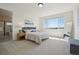 Bright bedroom with a comfortable bed, with a large window and luxury bath at 2515 Clayton Cir, Superior, CO 80027