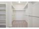 Walk-in closet with carpet, shelving, and plenty of storage at 2515 Clayton Cir, Superior, CO 80027