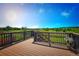Relaxing wood deck offering panoramic views of the lush green landscape under a bright sky at 2515 Clayton Cir, Superior, CO 80027