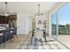 Bright dining area featuring a chandelier and a large sliding glass door to the deck at 2515 Clayton Cir, Superior, CO 80027