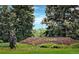 Entrance to Town of Superior with brick sign, landscaping, and views of green trees at 2515 Clayton Cir, Superior, CO 80027