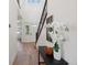 Elegant entryway with a wooden table, floral arrangement, high ceilings, and staircase, creating a welcoming ambiance at 2515 Clayton Cir, Superior, CO 80027