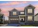 Charming two-story home with gray siding, a well-kept lawn, and an attached two-car garage at 2515 Clayton Cir, Superior, CO 80027