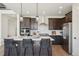 Stylish kitchen featuring an island with modern pendant lights and ample counter space at 2515 Clayton Cir, Superior, CO 80027