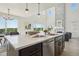 Bright kitchen with island, pendant lighting, views of the backyard and adjacent living spaces at 2515 Clayton Cir, Superior, CO 80027