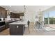 Open kitchen and dining area with large island, stainless appliances and deck access at 2515 Clayton Cir, Superior, CO 80027