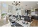 Open concept living and dining area featuring a fireplace and stylish decor at 2515 Clayton Cir, Superior, CO 80027