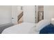 Bright main bedroom showing a glimpse of the stairs and the bathroom at 2515 Clayton Cir, Superior, CO 80027